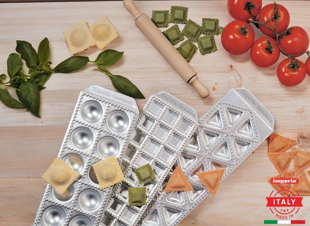 Imperia Ravioli Maker shown assembling fresh ravioli pieces.